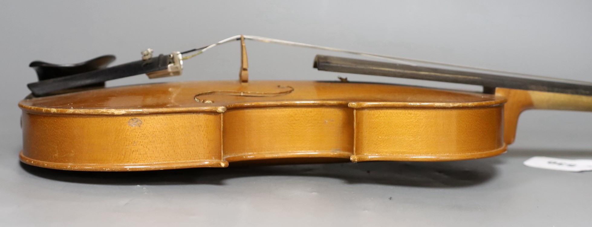A cased 20th century Romanian violin, back measures 35.5cm excl button